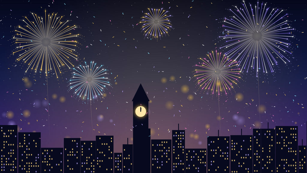 Fireworks over a city skyline at midnight on New Year's Eve